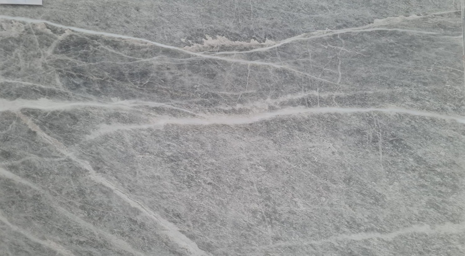 Fior Di Pesco marble surface with layered grey tones and white veining