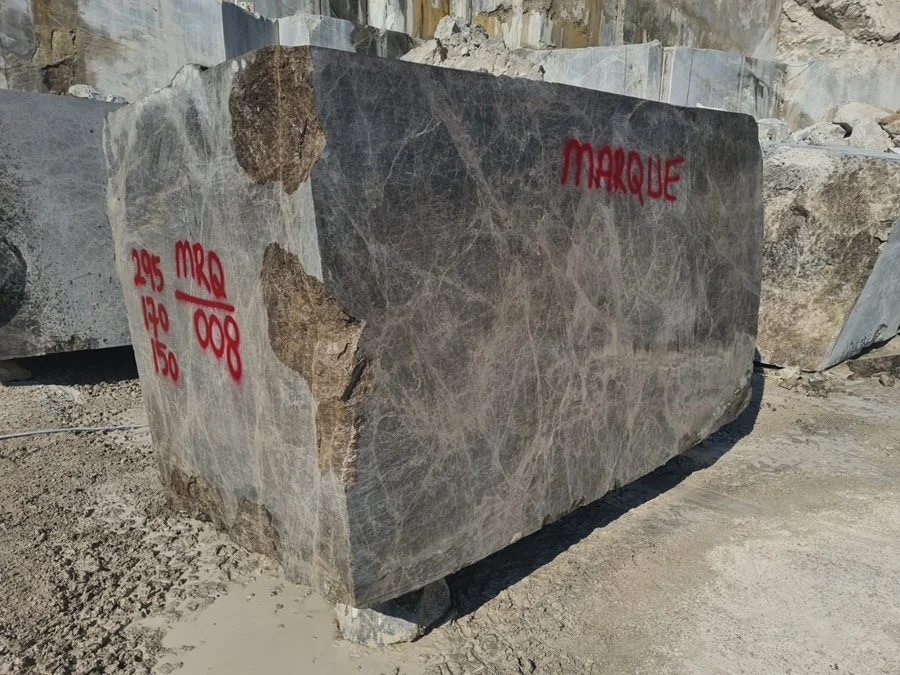 Dark Emperador marble quarry block with MARQUE marking and dimension grading | Marque Natural Stones